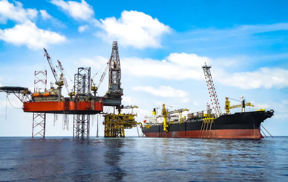 Offshore drilling platform and support vessel in operation