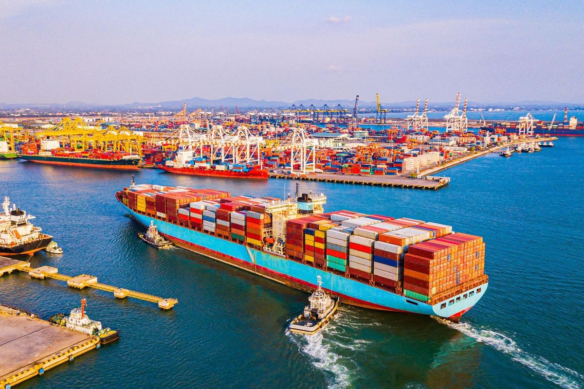 Container vessel arriving at an industrial port terminal